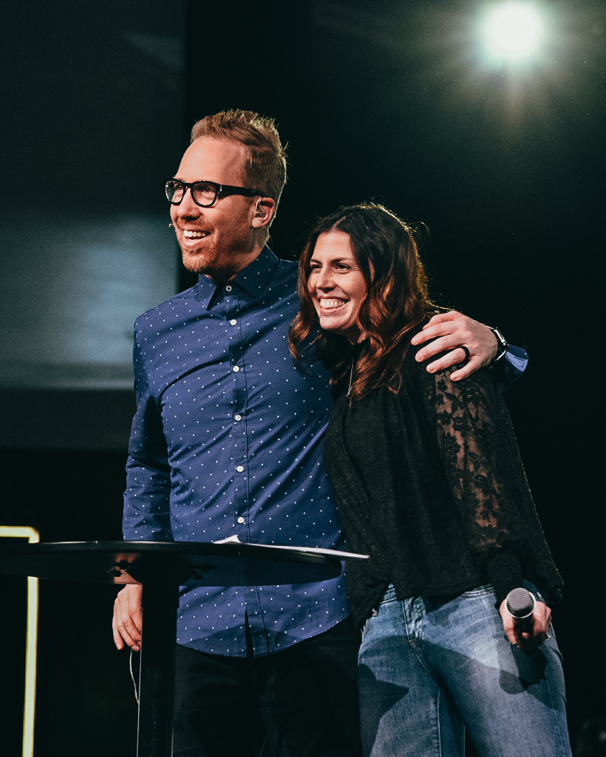 Pastors Peter and Carolyn Haas on stage together